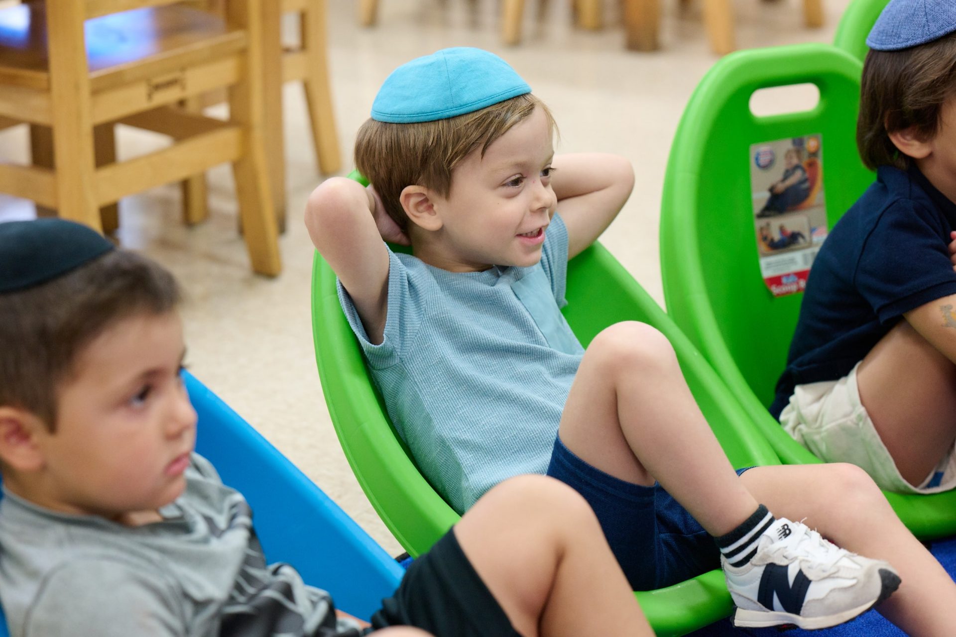 Kids seated in chairs