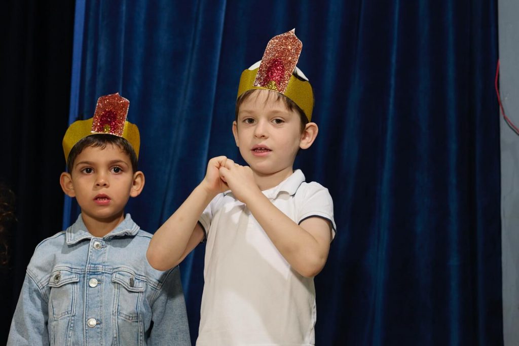 Two kids at the Festival of Lights show, close-up photo.