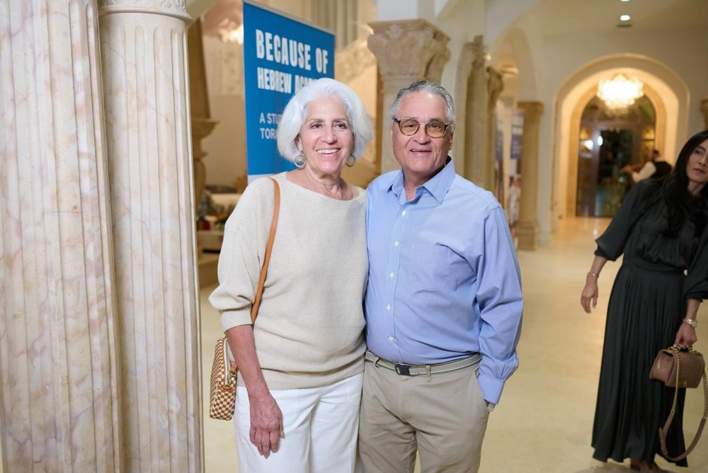 Close-up of a woman and man smiling for a photo at the Memorable Evening event at Hebrew Academy.