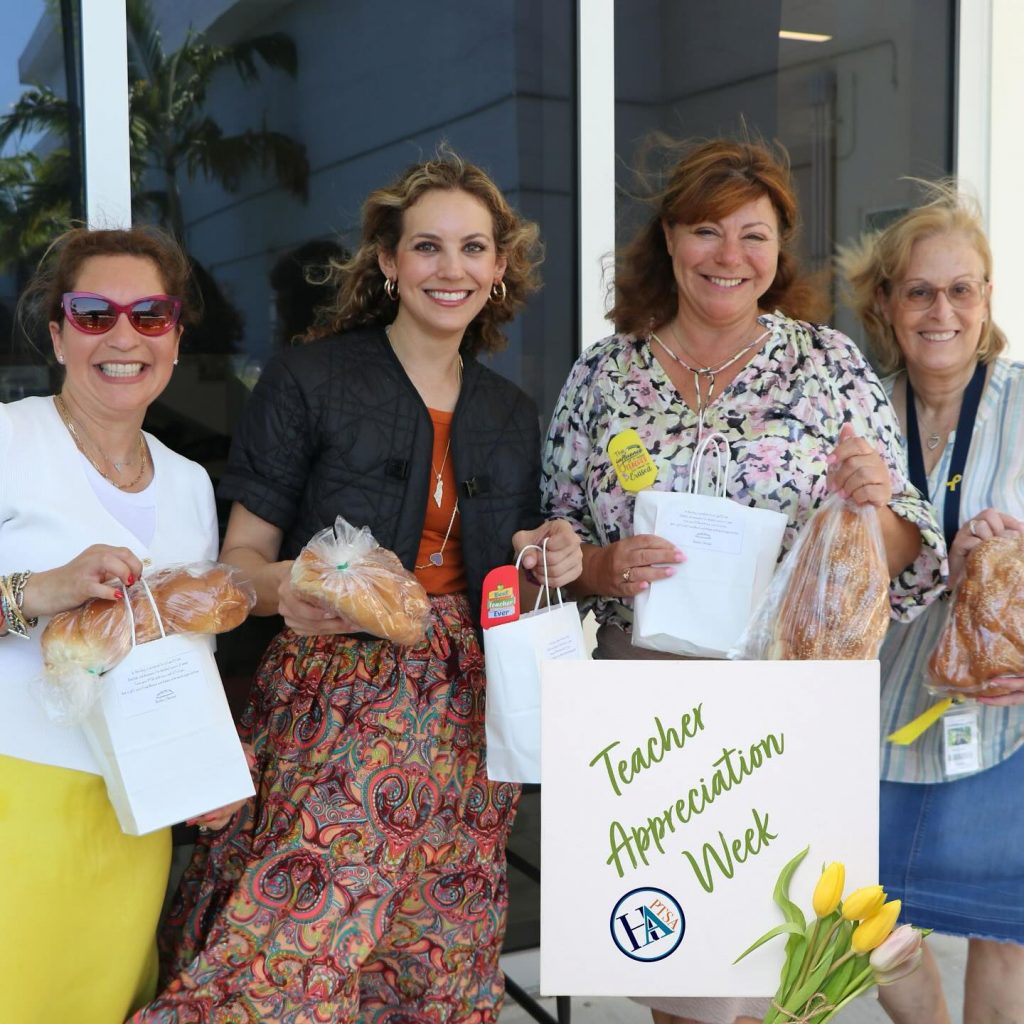 Four teachers smiling with gifts during Teacher Appreciation Week.