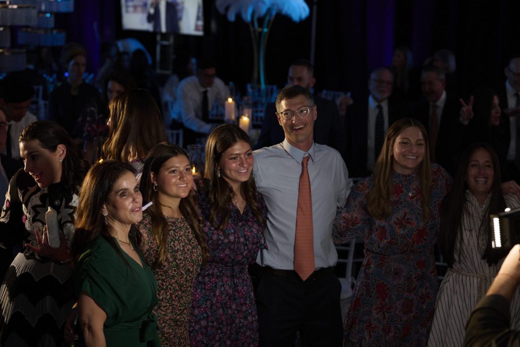 Smiling group photo at Hebrew Academy's 76th Annual Light event.