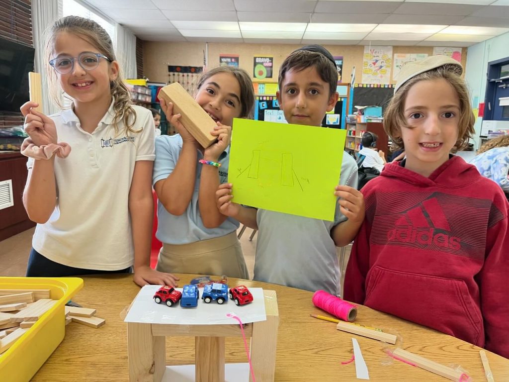 Group of children smiling during a workshop.