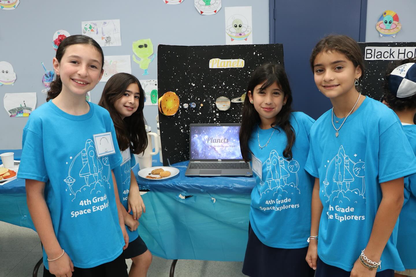 4th Graders Shine as Space Museum Hosts, Showcasing Stellar Projects to Parents and Peers